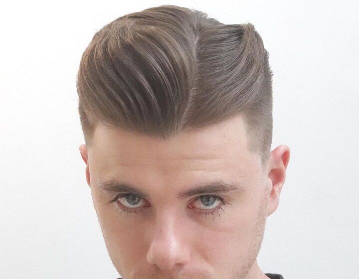 Mid Taper Fade met Hard Part Comb Over