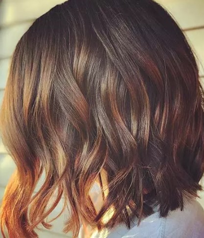 Warm getinte koperen haarkleur highlights