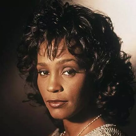 Whitney Houston jaren 80 kapsel